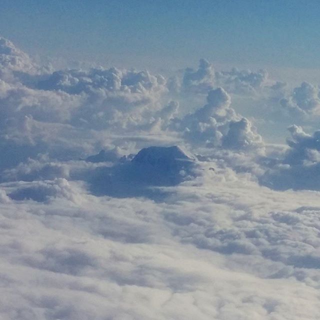 Flying back from meeting in Milan. That's a mountain poking through the clouds! #cloudtoparchipelago #alps
